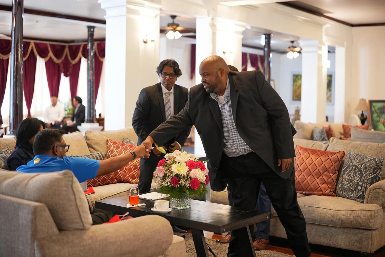 A handshake at the Office of the President following the GRIZ strategic session